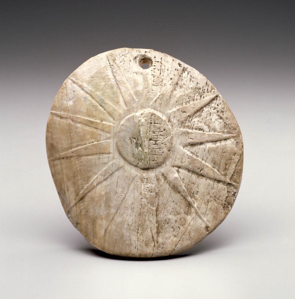 Engraved shell pendant