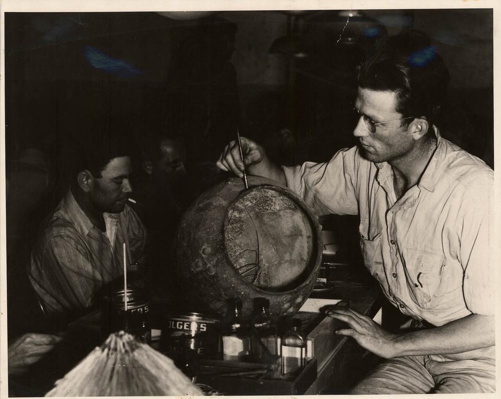 WPA workers reconstructing ceramics