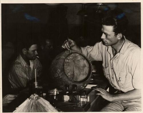 WPA workers reconstructing ceramics