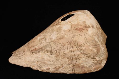 Engraved shell cup with long-nosed maskette on floating head