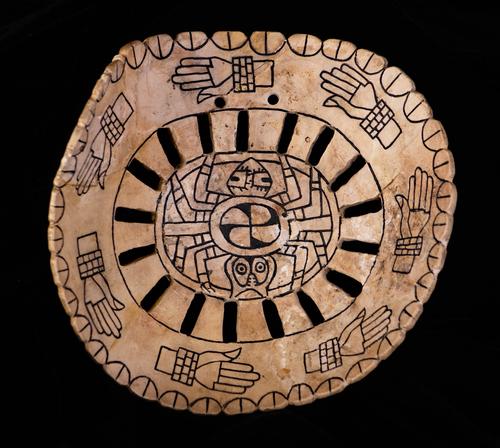 Engraved shell gorget with hands and spider