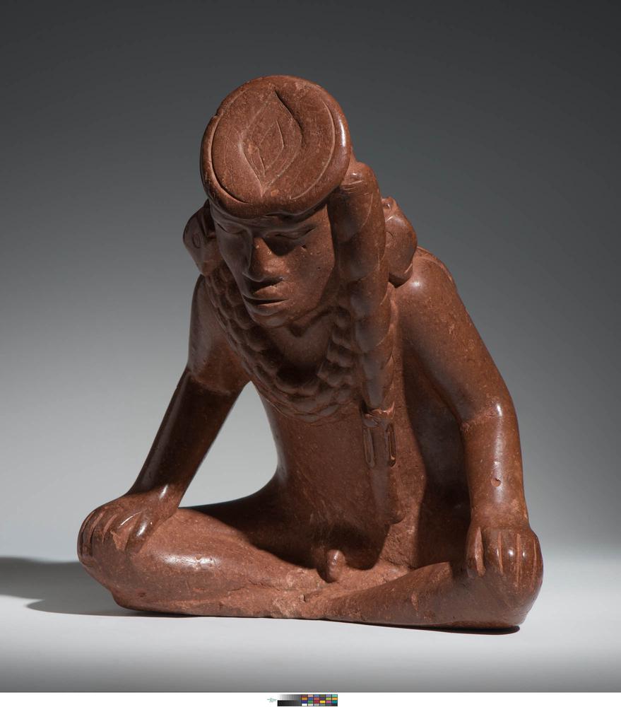 Effigy pipe of seated male figure