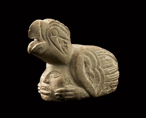 Raptor with human head effigy pipe