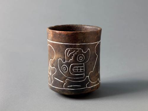 Cup with incised long bone and skull motifs