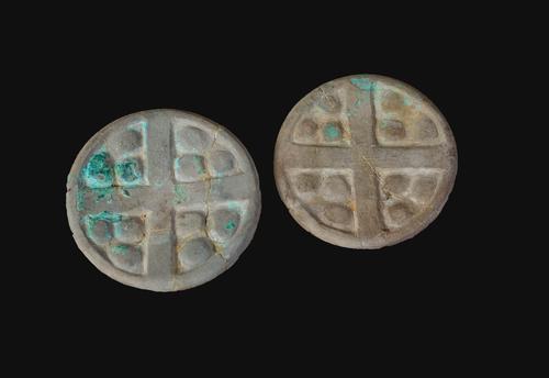 Earspool with cross motif
