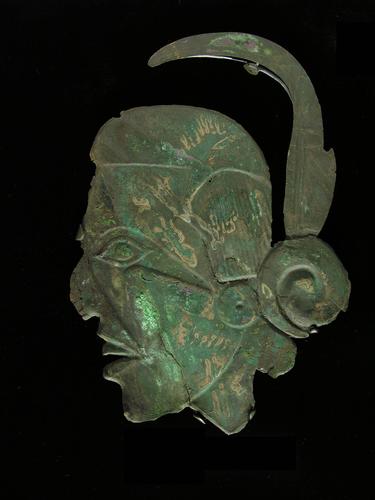 Human head effigy plate